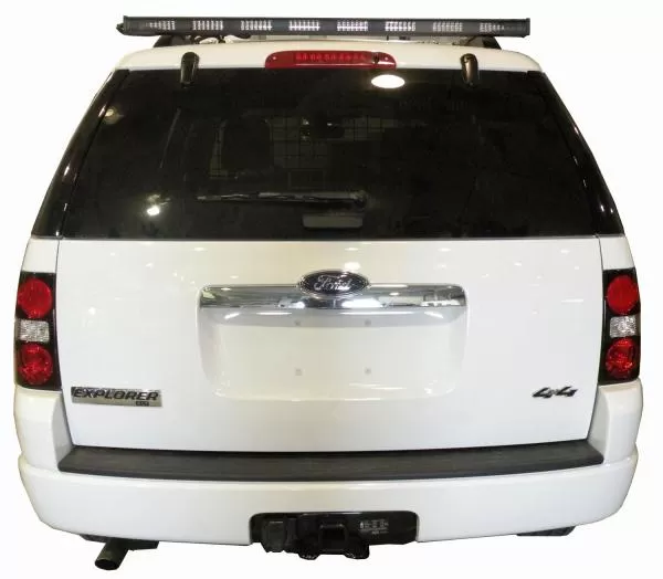 Rear view of a white Ford Explorer with the unlit 48-inch directional light bar mounted on the roof