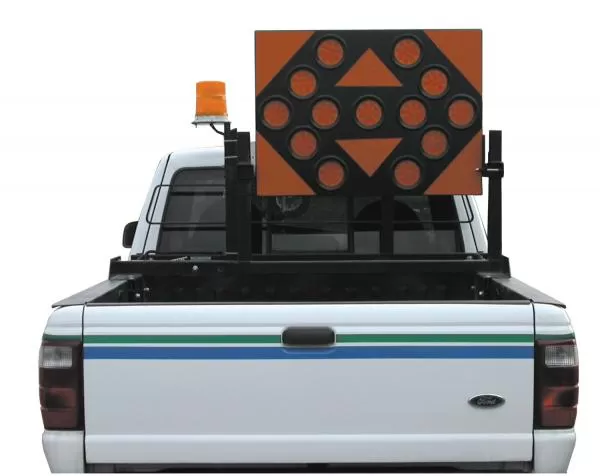 D&R AB253513 TC-12 arrowboard on a bed rack of a white pickup with an amber beacon beside it