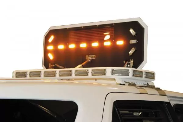 Motorized board tilted up on its arms with one amber arrow lit and the lift mechanism visible underneath