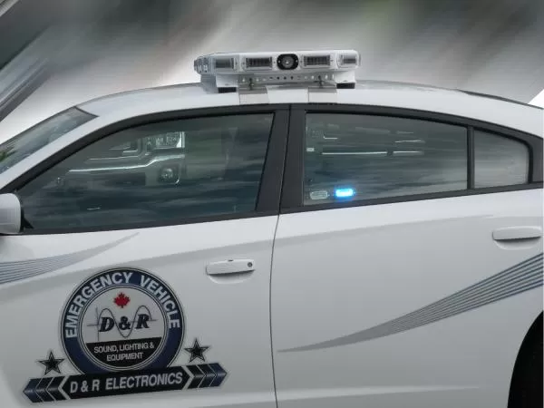 Optional MR6 linear LED lit blue in the rear window of a white Charger with D&R door decal