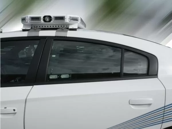D&R WB-CHARGER window bars in the rear side window of a white Dodge Charger police cruiser