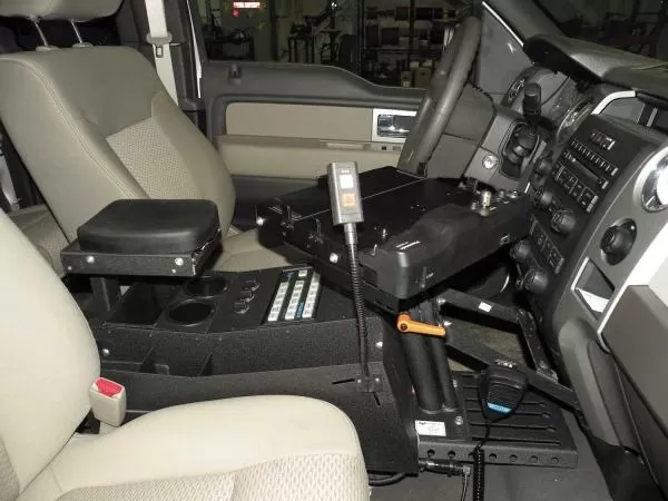 D&R SRCSUV 18" sloped emergency vehicle console fitted between the front seats with armrest and cup holders