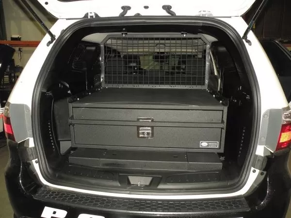 D&R 933-0102A single drawer storage system installed in the cargo area of a white Dodge Durango