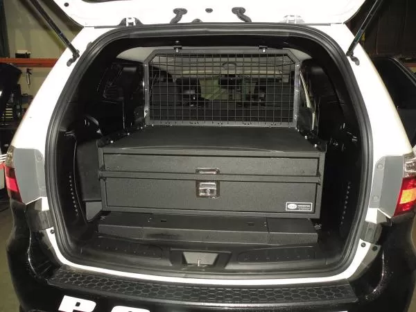 D&R 933-0102A single drawer storage system installed in the cargo area of a white Dodge Durango