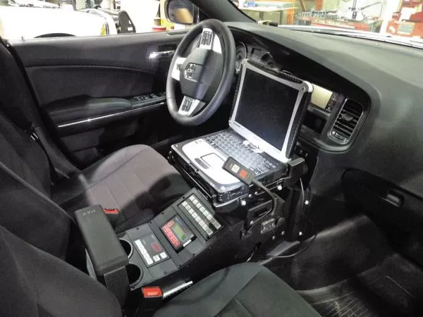 D&R 901-0086A console fitted in a Dodge Charger with laptop mount, siren control head and sliding armrest