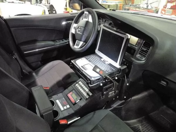 D&R 901-0086A console fitted in a Dodge Charger with laptop mount, siren control head and sliding armrest