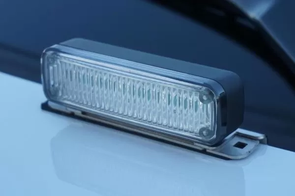 D&R Genesis LED light module deck mounted on a white cruiser hood, clear lens and stainless steel bracket