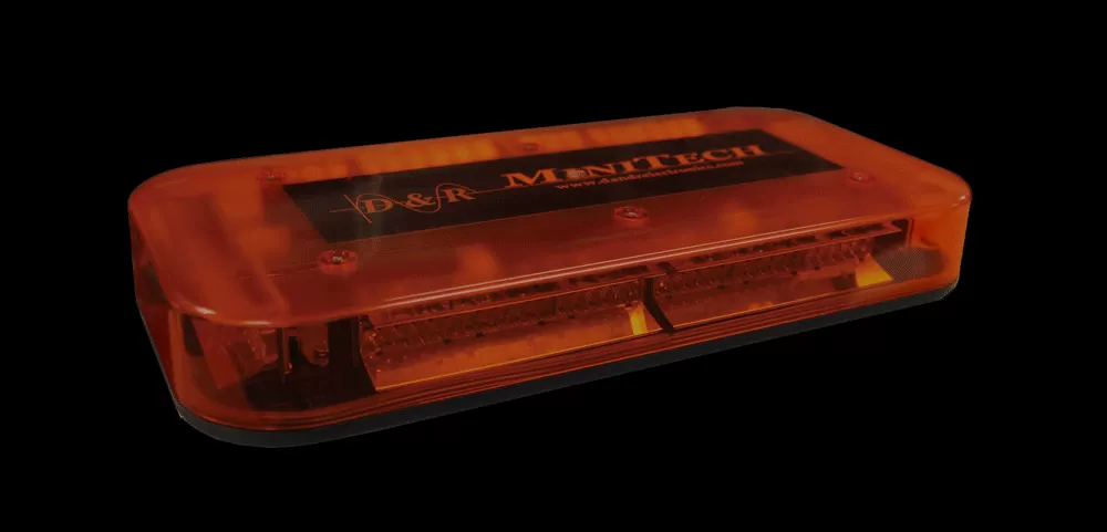 Close-up of the bar bolted to the rack crossbar on rubber isolator feet, amber lens unlit
