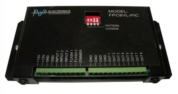D&R FPC8VL-PIC interior lightbar flasher, top view with red DIP switch and green terminal blocks