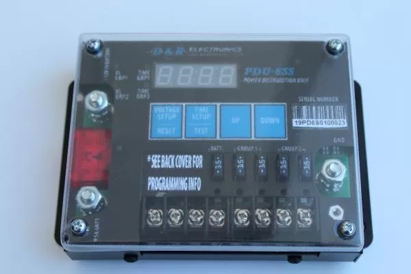 D&R PDU-6SS power distribution unit sealed under its clear Plexiglas dust cover with LED voltage display