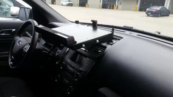 Empty dash mount plate fitted above the centre stack of a Ford SUV, seen from the driver's seat