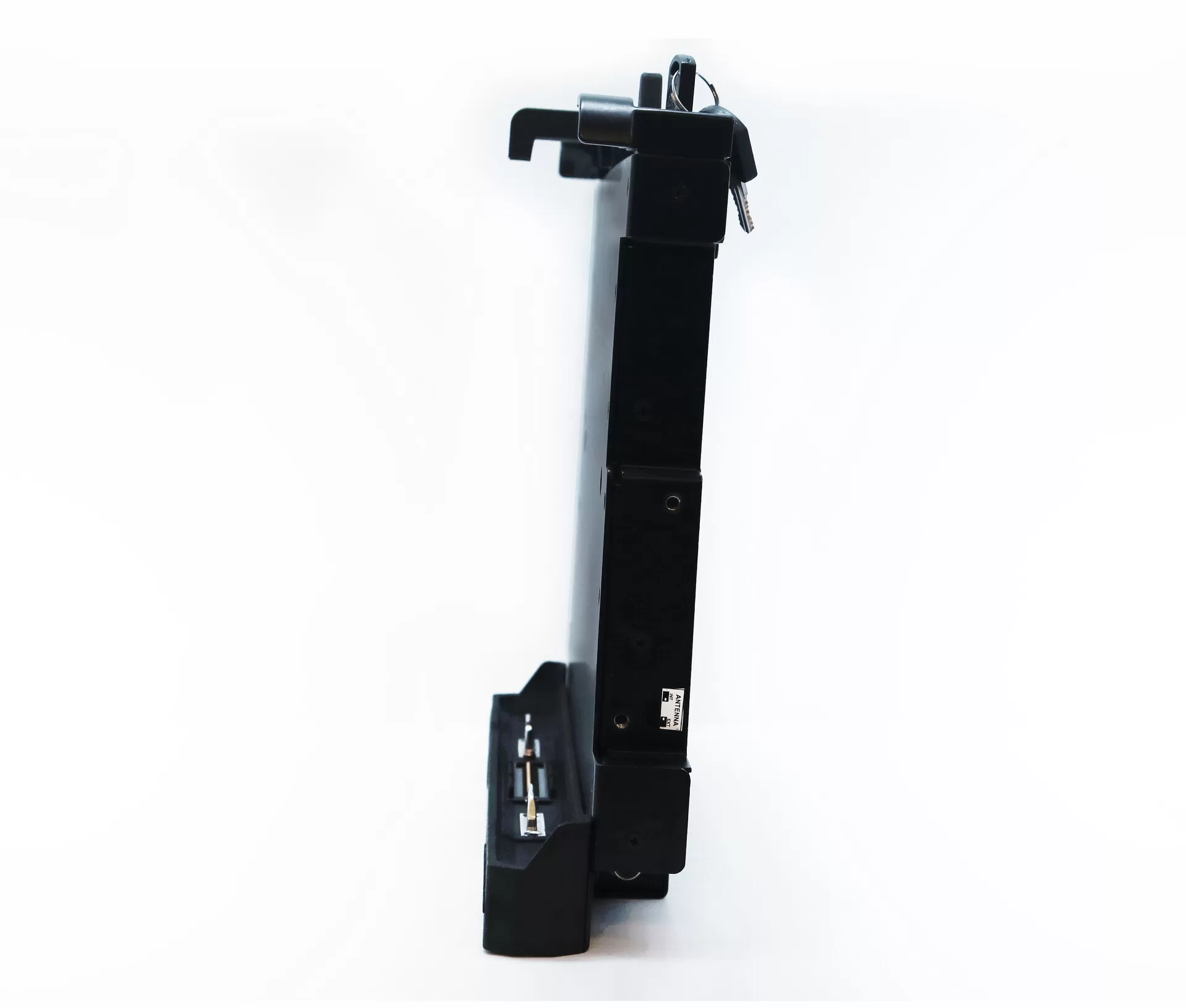 Narrow side profile with the key standing out of the lock at the top and the connector at the foot