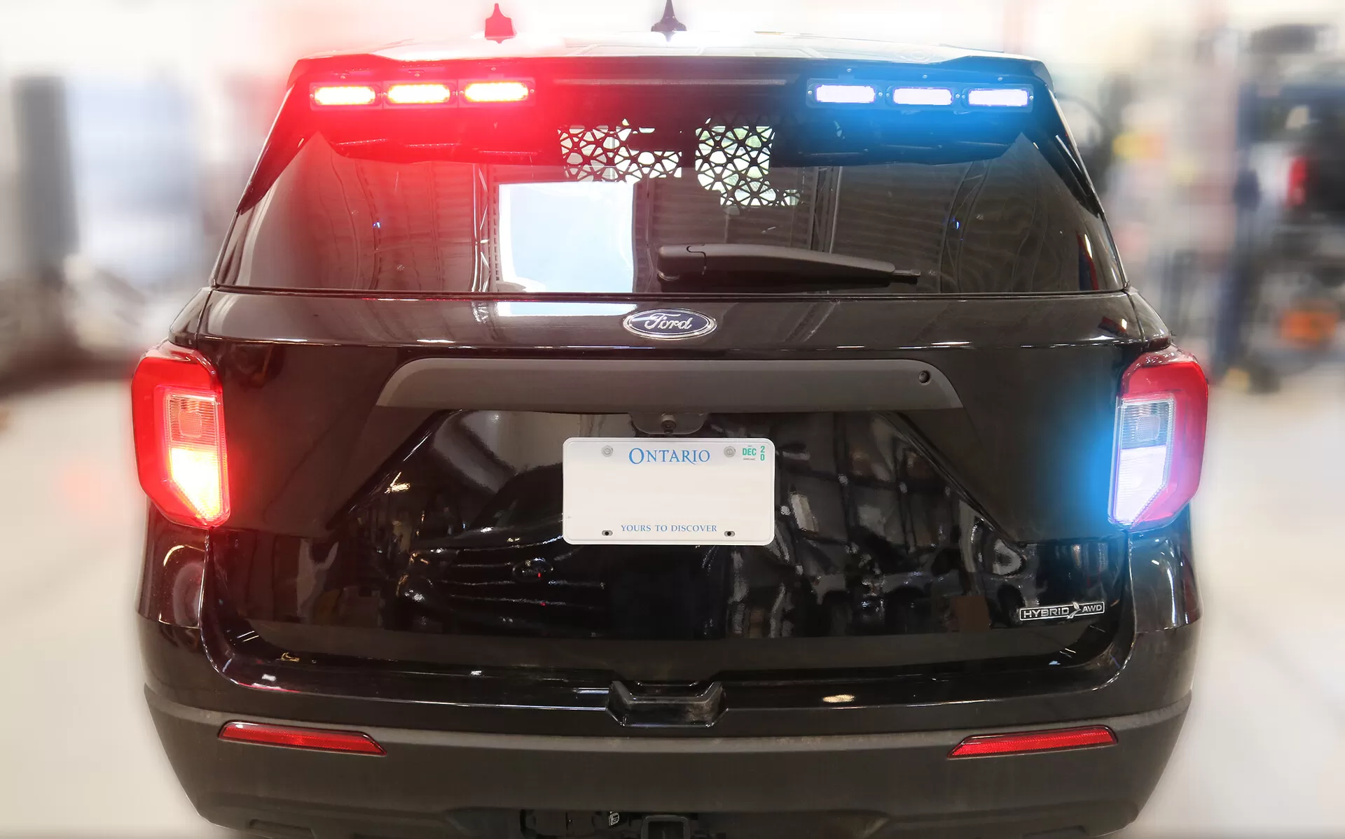Black 2020 Ford Interceptor Utility with the spoiler stick flashing red on the left and blue on the right
