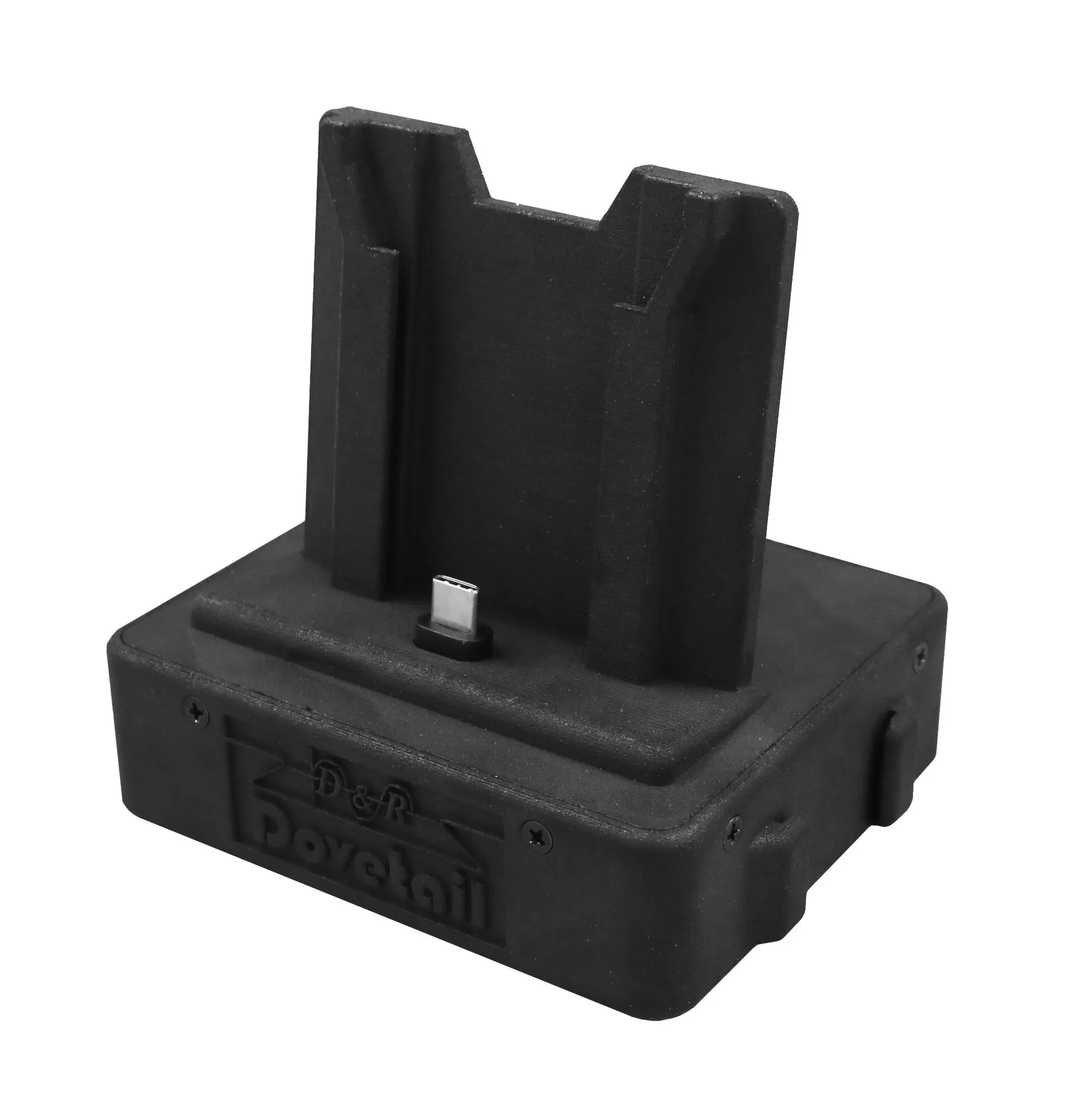 Angled shot of the production unit, USB-C pin upright in the cradle and the logo embossed on the housing