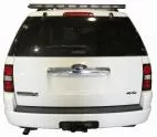 Rear view of a white Ford Explorer with the unlit 48-inch directional light bar mounted on the roof