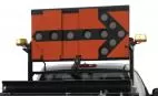 Unlit board showing the black lamp bezels forming a right-pointing arrow on the orange reflective face