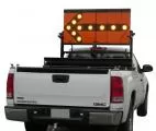 D&R ERT306014KHT-FL TC-12 arrowboard kit raised behind the cab of a white GMC Sierra, left arrow lit