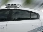 D&R WB-CHARGER window bars in the rear side window of a white Dodge Charger police cruiser