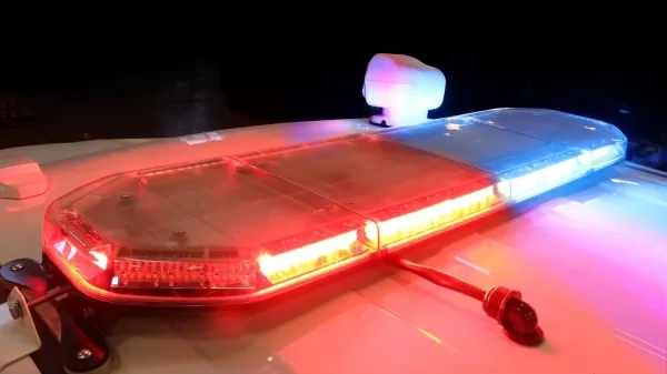 D&R Synergy LED lightbar on a cruiser roof at night, red and blue modules lit behind a clear lens