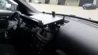 Empty dash mount plate fitted above the centre stack of a Ford SUV, seen from the driver's seat