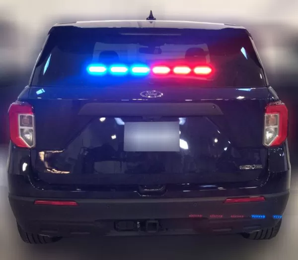 Rear window of an Explorer with the left three modules flashing blue and the right three red