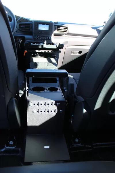 Straight-on rear view of the console showing the vented side panel, cup holders and centre armrest