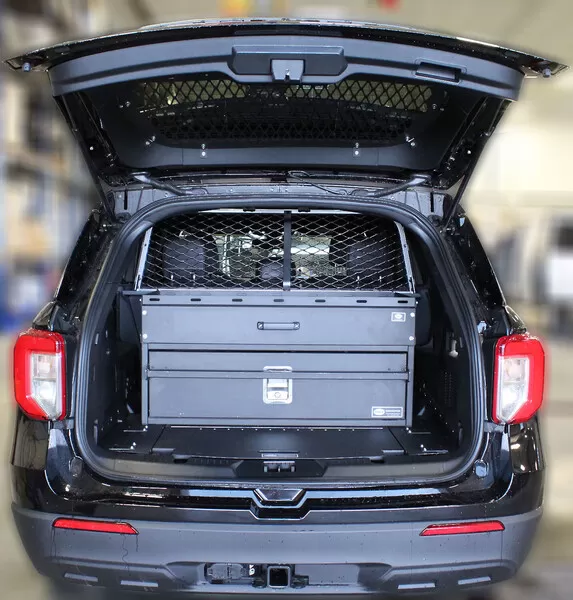 Liftgate open on a black Explorer showing the hatch glass screen and the drawer unit in the cargo bay