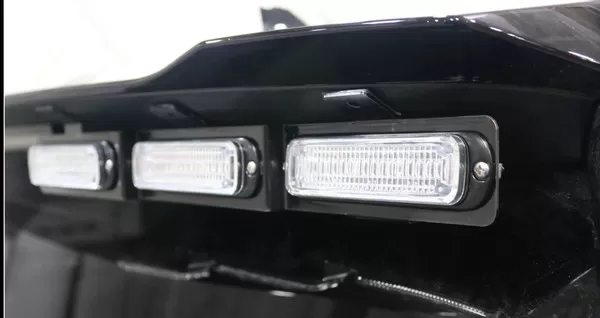 D&R GT2FTL-PIC-EXP20 exterior lightbar close-up, three clear-lens LED modules along the rear spoiler edge