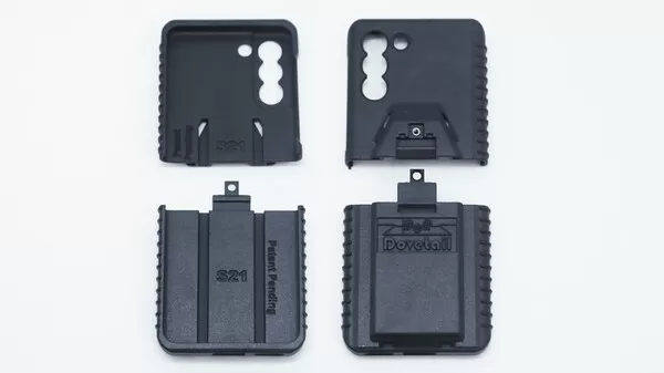 Four moulded case parts laid out flat, inner faces marked S21 beside the logo-stamped outer backs