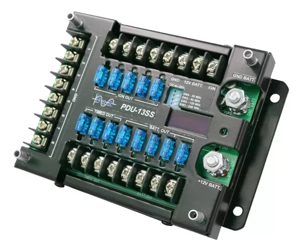 Cover removed, showing the IGN OUT, TIMED OUT and BATT. OUT fuse banks with blade fuses fitted